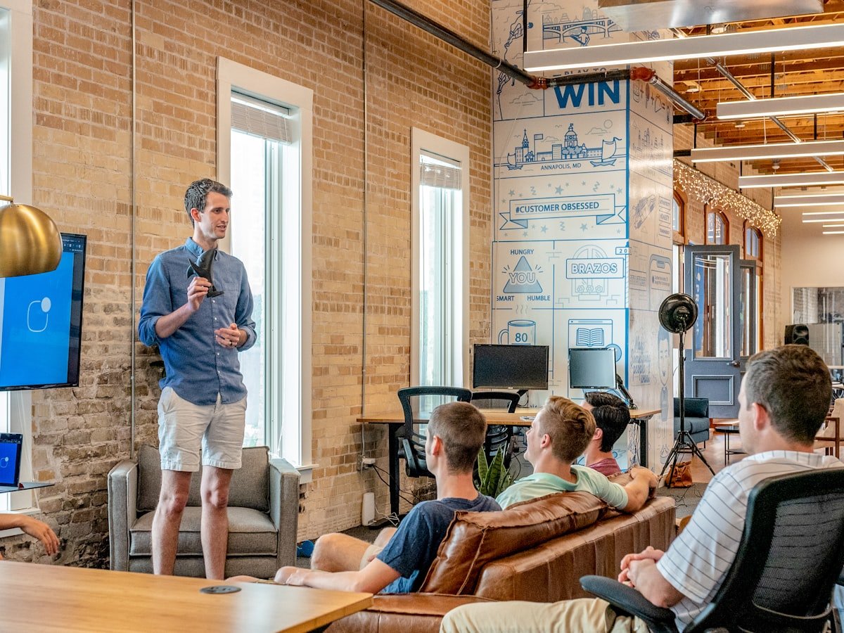 A trainer presenting to a small group of managers