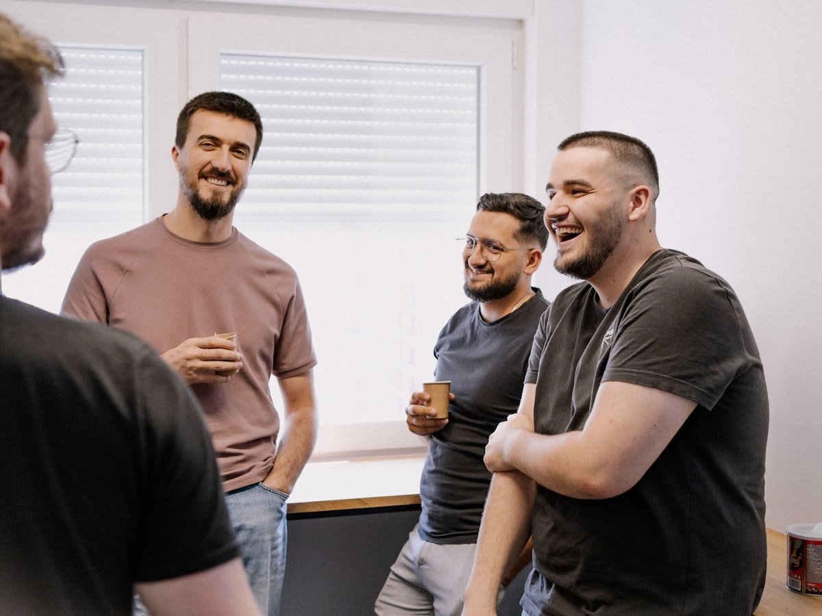 A group of men in a workshop session